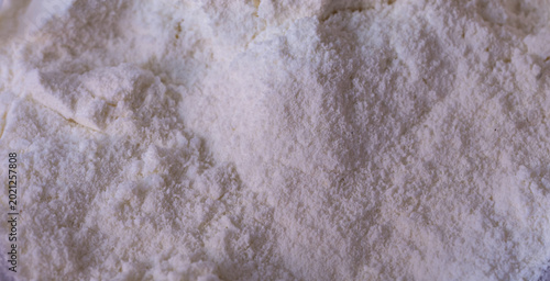 фотографія Texture of white protein powder with fine granules and soft nutritional supplement background