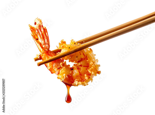 Crispy golden tempura shrimp with savory dripping sauce held by wooden chopsticks.