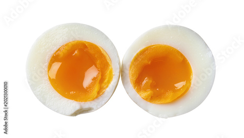 Canvas-taulu Two halves of a soft-boiled egg with runny orange yolks, isolated on transparent