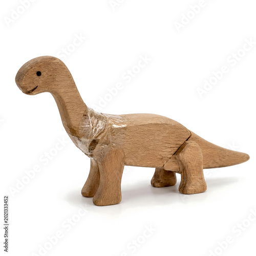 Wooden Dinosaur Toy Repaired with Transparent Tape Isolated on White Background