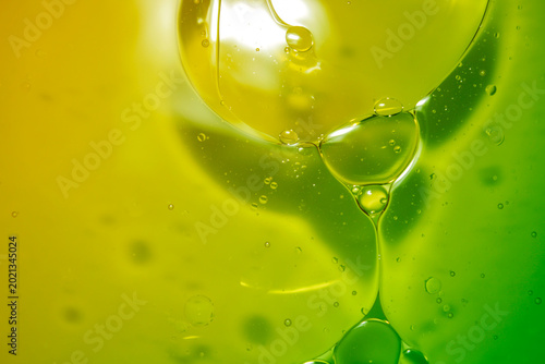 Quadro su tela Abstract Colorful Liquid Drops in Yellow and Green Background