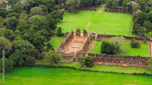 Aerial view of San Ignacio Miní Jesuit mission ruins over green fields, Misiones, Argentina, UNESCO World Heritage site