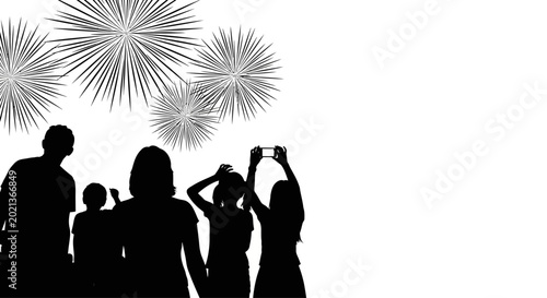 Silhouette of a family watching fireworks celebration.