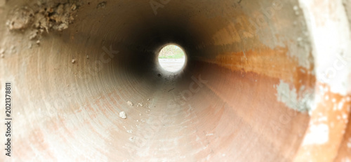Construction of concrete pipes inside a work site during daylight hours