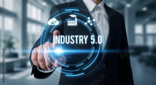 Businessman touching a futuristic holographic screen displaying Industry 5.0 with of factory and cloud