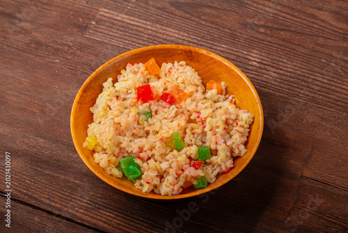 Fotografie Sweet couscous with dried fruits and nuts served with butter