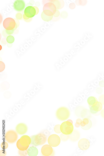 Soft pastel green and yellow bokeh circles on white background 