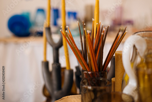 Quadro em tela Burning taper candles and home decor close up interior scene.