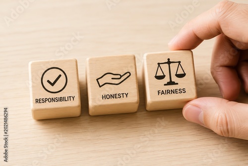 Wooden blocks with responsibility honesty and fairness text concept.