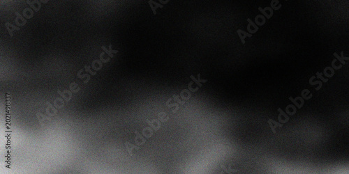 Bild auf Leinwand A dark textured background of swirling black smoke and mist creates a design wit