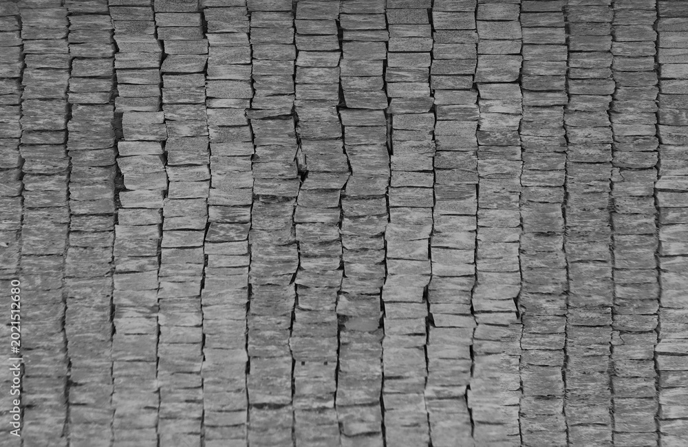 Fototapeta premium Front view of a wall made of gray slabs. background of a new and modern wall or building exterior grey slabs Marble brick pattern floor abstract natural marble black gray wall Top view and front view