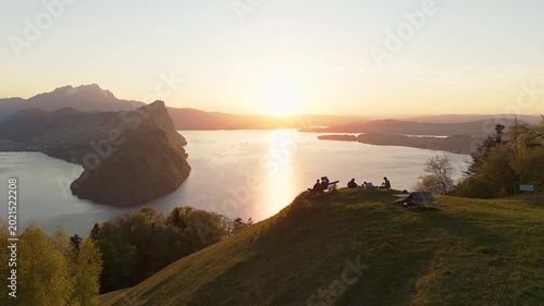 Aerial Drone View of People Watching Sunset Over Lake Lucerne from Märibänkli Viewpoint Above Vitznau, Rigi, Switzerland