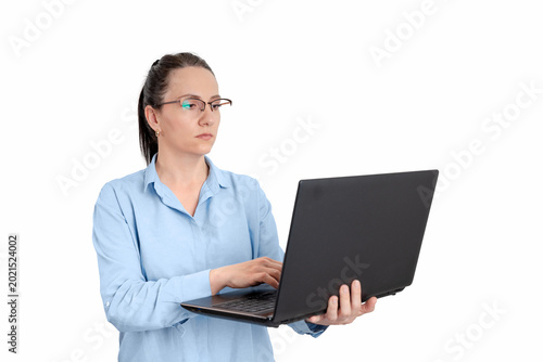 Professional businesswoman holding and using laptop isolated on white background, suitable for remote work, technology and business concepts
