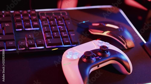 RGB pulse hitting white-black gamepad, emitting shapes floating, clustering to highlight buttons