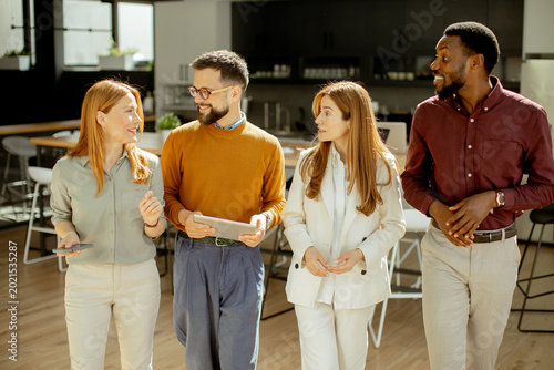 Group of four people discus...