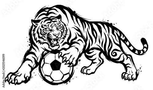 Photos Powerful roaring tiger attacking a soccer ball in dynamic graphic mascot style