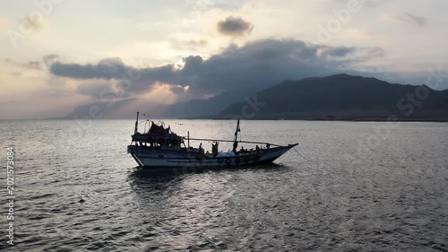 Aerial view of a fishing boat at sunset, Socotra island