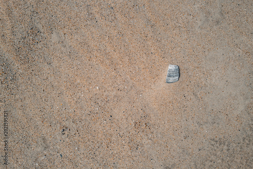 Natural Beach Surface with Single Stone and Grain Detail