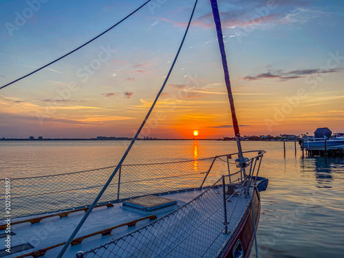 sailboat at sunrise