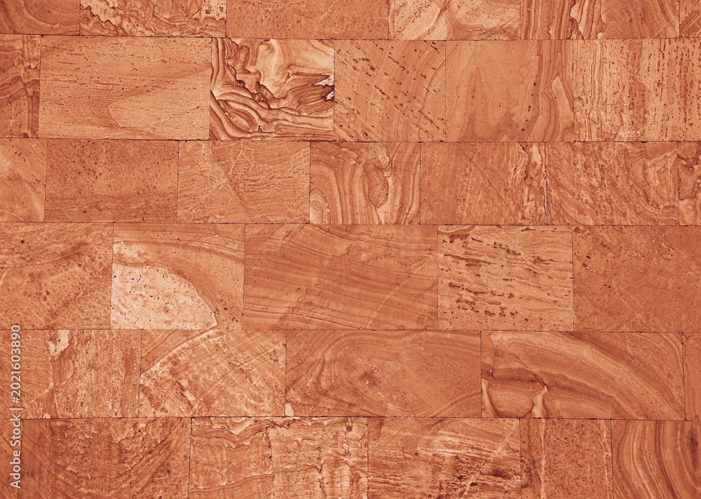 Obraz premium Front view of wall made of brown slabs. background of modern wall building exterior grey slabs Marble brick pattern floor abstract natural marble black wall Top view front view peach fuzz