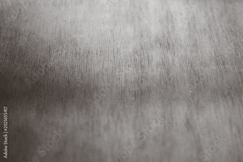 Foto Brushed metal surface showcasing a textured silver and gray background, reflecti