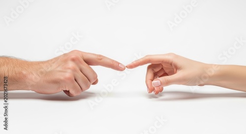 Two Human Hands Reaching Out to Touch Forefingers Against a White Background, Symbolizing Connection and Interaction