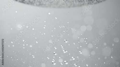 Abstract background with floating particles of light and bubbles, creating an ethereal and dynamic effect