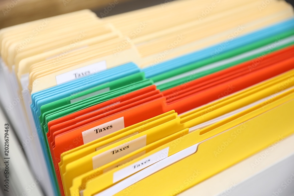 Fototapeta premium Tax. Many folders in drawer of cabinet in office, closeup