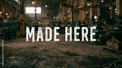 Factory Innovation: Craftsmanship and Creativity in Industrial Manufacturing Workspace with Heavy Machinery and Skilled Artisans at Work