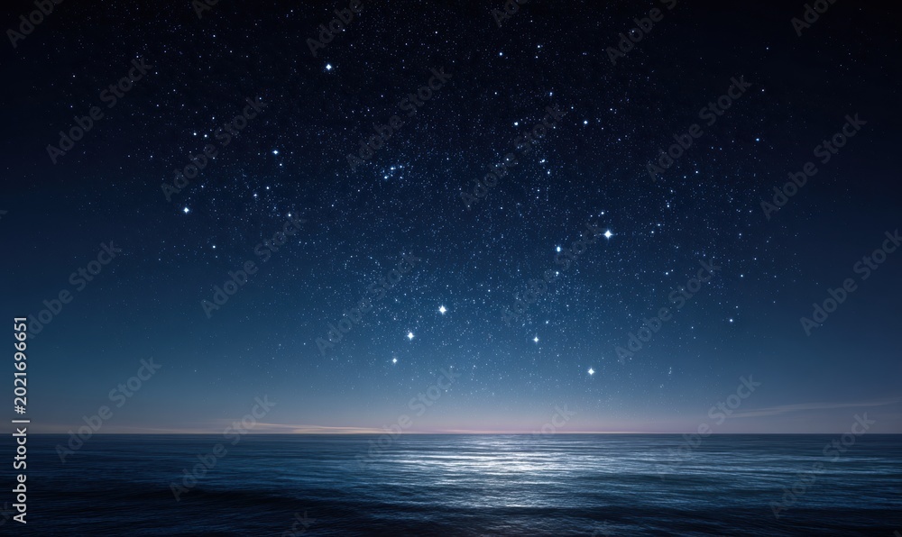 Fototapeta premium Night sky with stars reflecting on tranquil ocean surface