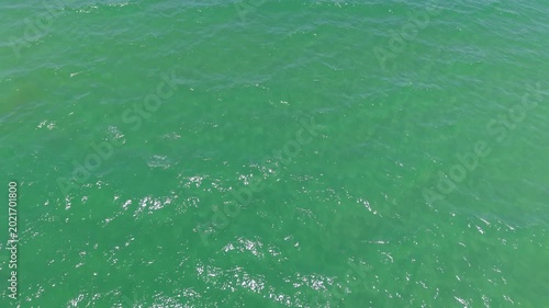 Aerial view drone top shot of over tropical sea. Royalty high-quality free best stock of beautiful wave calm, blue water surface background, top view texture. Turquoise sea backgrounds, paradise relax