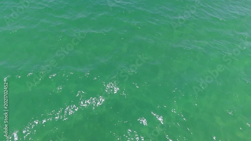 Aerial view drone top shot of over tropical sea. Royalty high-quality free best stock of beautiful wave calm, blue water surface background, top view texture. Turquoise sea backgrounds, paradise relax
