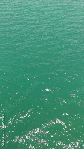 Aerial view drone top shot of over tropical sea. Royalty high-quality free best stock of beautiful wave calm, blue water surface background, top view texture. Turquoise sea backgrounds, paradise relax