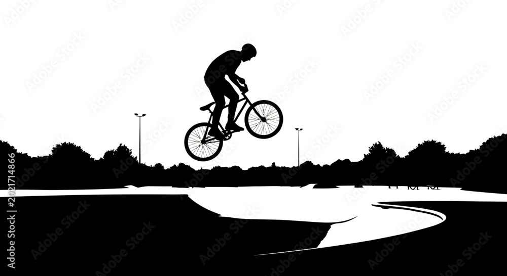 Fototapeta premium BMX rider performing jump stunt in skatepark silhouette