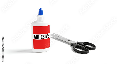 A bottle of adhesive and scissors are placed on a table indoors.