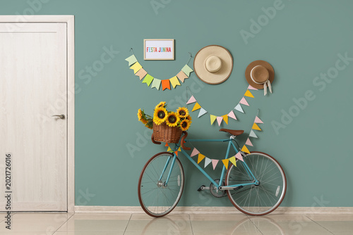 Bicycle with sunflowers nea...