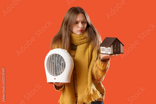 Frozen young woman with hou...