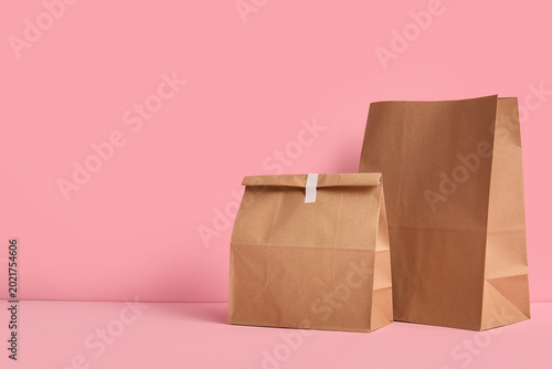 Paper bags on pink backgrou...