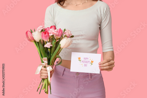Young woman holding bouquet...