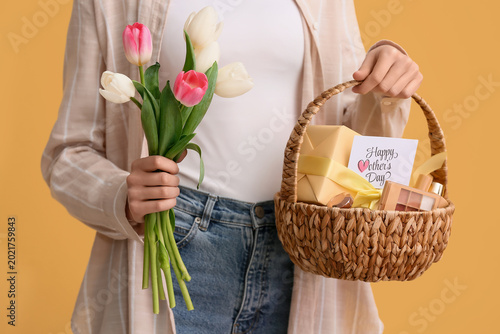 Young woman holding basket ...