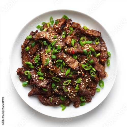 Spicy bulgogi - Korean chili-marinated beef with sesame seeds isolated on a white background