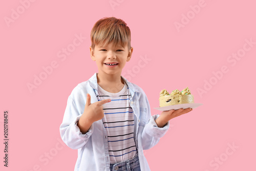 Cute little boy pointing at...