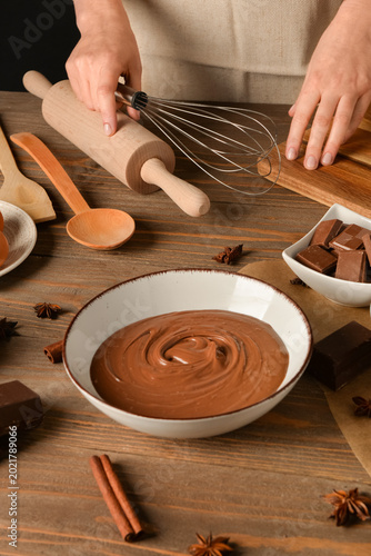 Woman preparing tasty melte...