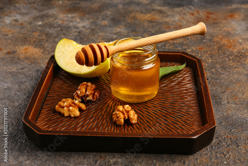 Tray with jar of sweet hone...