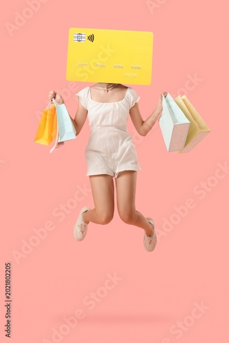 Jumping woman with credit c...