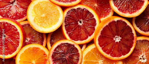 Canvastavla Many slices of juicy blood orange fruits as background