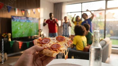 Family and friends cheering on TV
