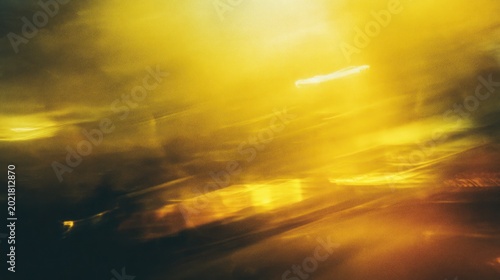 Abstract golden light and motion background with dynamic shapes and textures