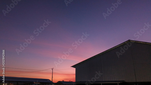 Quadro em tela Buildings in the morning sky background with a purplish pink glow