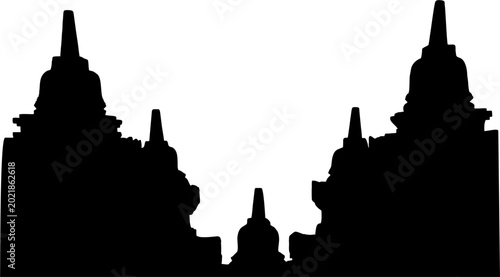 Fotografija Black silhouette of an ancient tiered temple complex with multiple stupas against a stark white background, showcasing intricate architectural forms